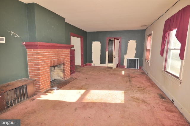 unfurnished living room with a fireplace