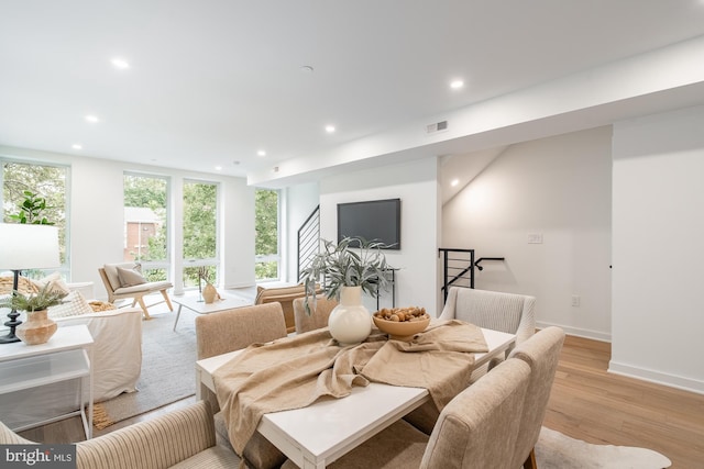 dining area with light hardwood / wood-style floors