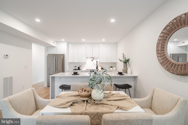 dining area with light wood-type flooring