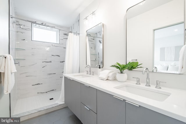 bathroom with vanity, tile patterned floors, and walk in shower