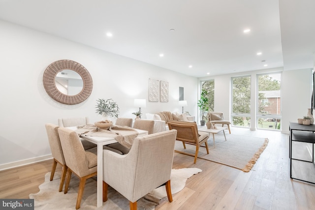 dining area with light hardwood / wood-style flooring