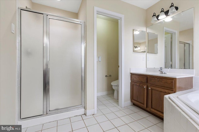 full bathroom with tile patterned flooring, vanity, separate shower and tub, and toilet