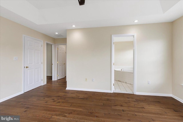 spare room with dark hardwood / wood-style floors