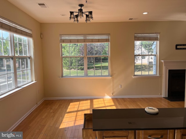 living room with hardwood / wood-style floors and a healthy amount of sunlight