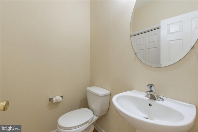 bathroom with toilet and sink