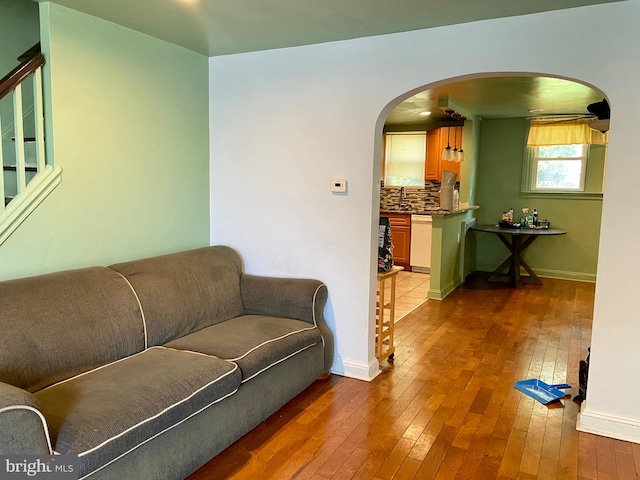 living room with sink and hardwood / wood-style flooring