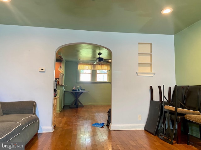 dining space featuring ceiling fan and wood-type flooring