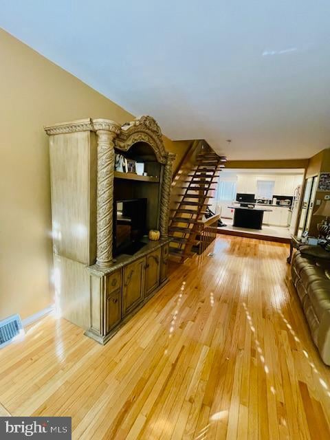 unfurnished living room with light wood-type flooring