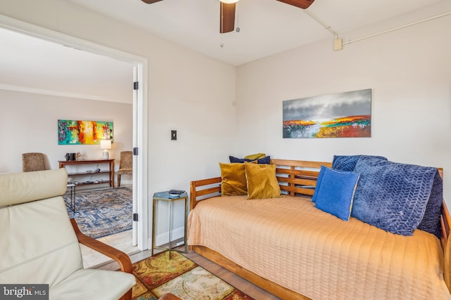 bedroom featuring hardwood / wood-style floors and ceiling fan