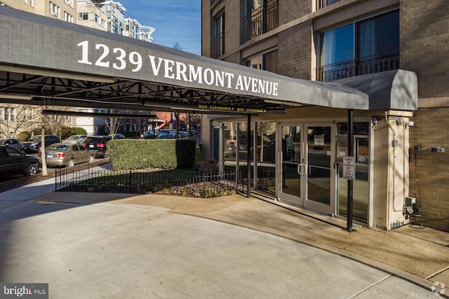 1239 Vermont Ave NW Unit 602, Washington, DC 20005 - view of building exterior featuring covered parking