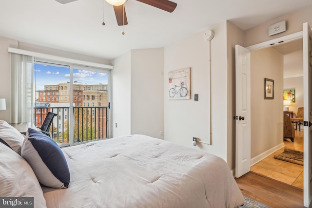 bedroom featuring access to outside, ceiling fan, and hardwood / wood-style flooring