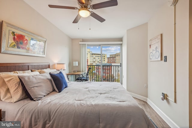 bedroom featuring access to exterior, ceiling fan, and hardwood / wood-style flooring