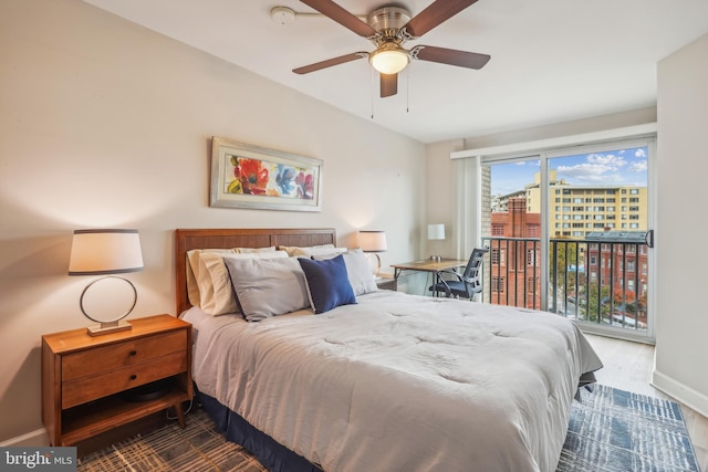 bedroom featuring access to exterior, wood-type flooring, and ceiling fan