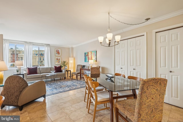 dining area featuring crown molding and a notable chandelier