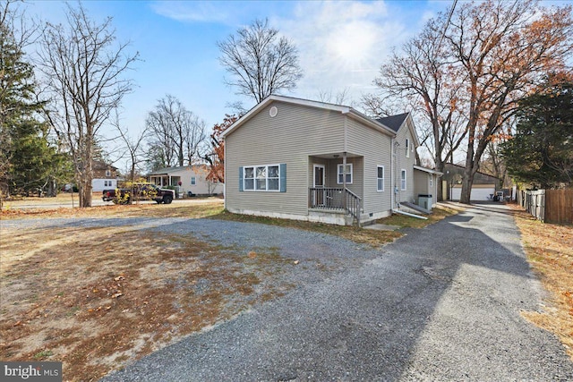 view of property exterior with an outbuilding and a garage