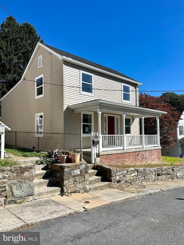 view of front of home featuring covered porch