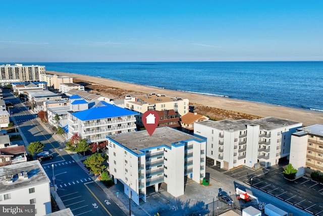 bird's eye view featuring a beach view and a water view