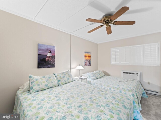 bedroom with carpet floors, baseboard heating, ceiling fan, and an AC wall unit