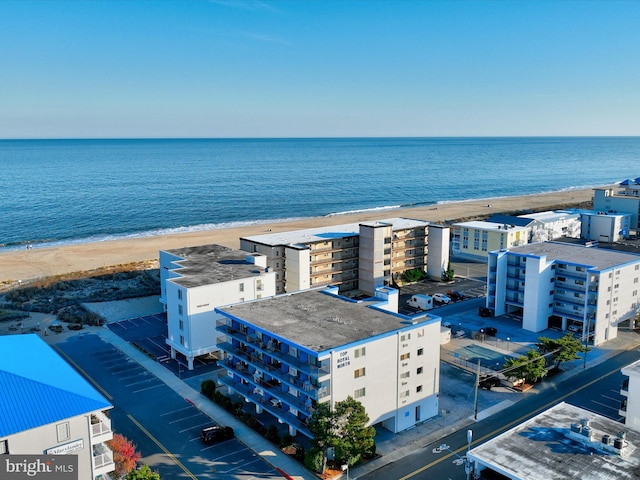 aerial view with a water view and a view of the beach