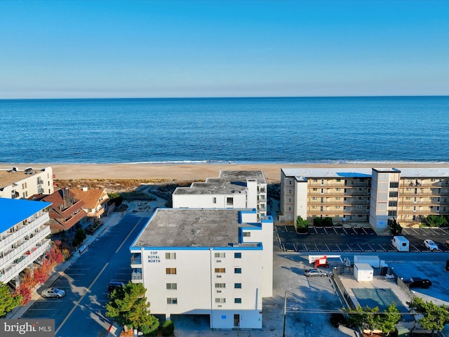 birds eye view of property featuring a water view and a view of the beach