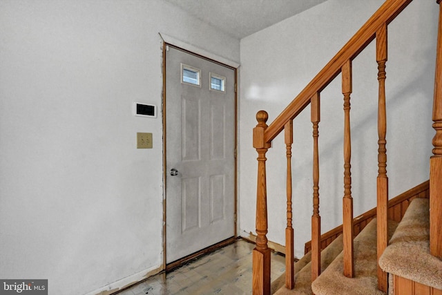 entryway with wood-type flooring