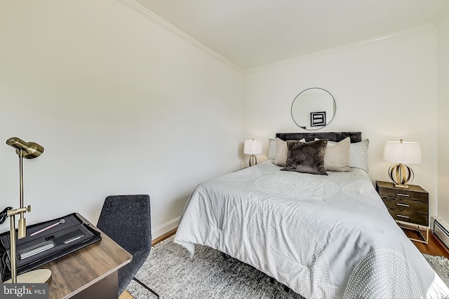 bedroom with dark hardwood / wood-style floors and ornamental molding