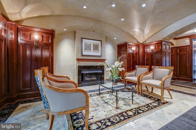 living area featuring vaulted ceiling