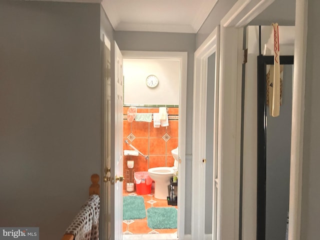 hallway featuring ornamental molding