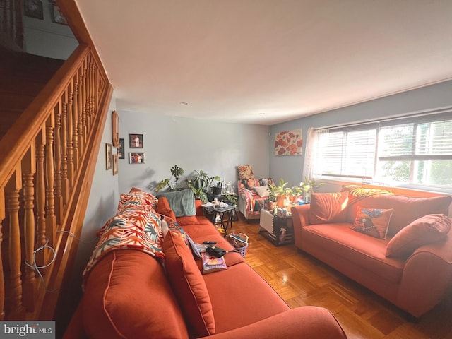 living room featuring parquet flooring