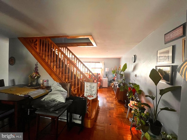 dining area with parquet flooring