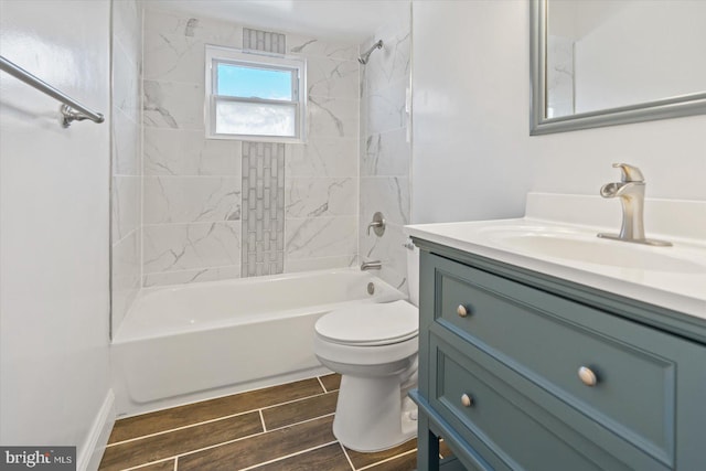 full bathroom featuring vanity, toilet, and tiled shower / bath