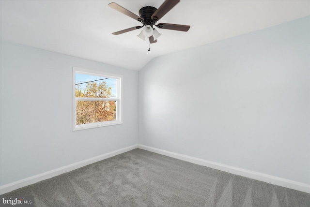 empty room with carpet flooring, ceiling fan, and lofted ceiling