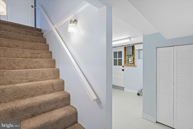 stairs featuring carpet floors