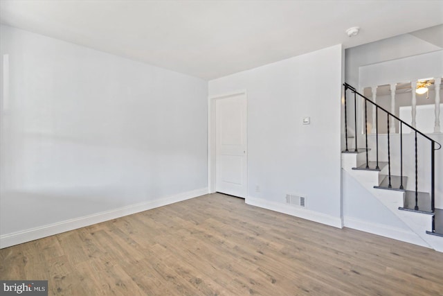 unfurnished room featuring light hardwood / wood-style floors