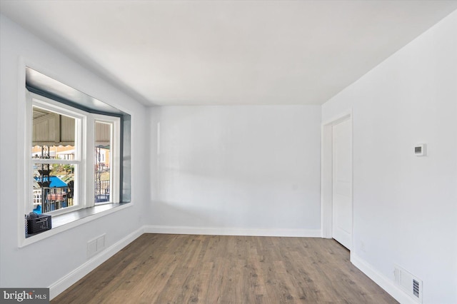 empty room featuring hardwood / wood-style flooring