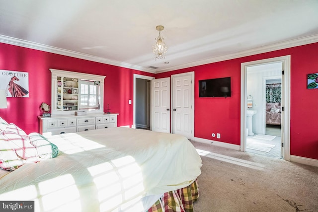 carpeted bedroom featuring connected bathroom and ornamental molding