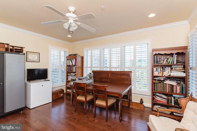 dining space with ceiling fan, dark hardwood / wood-style flooring, and ornamental molding