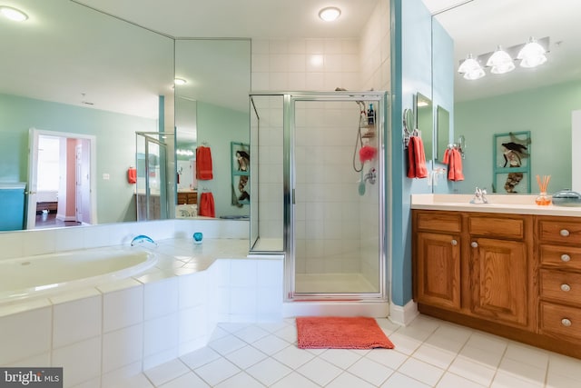 bathroom with vanity, tile patterned floors, and walk in shower