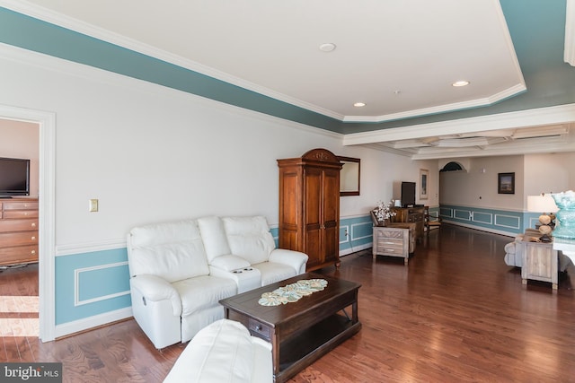 living room featuring beam ceiling, dark hardwood / wood-style floors, and ornamental molding