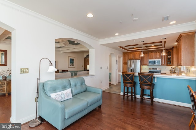 living room featuring beamed ceiling, ornamental molding, dark wood-type flooring, and coffered ceiling