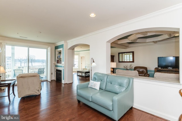 living room featuring beam ceiling, dark hardwood / wood-style flooring, ornamental molding, and coffered ceiling