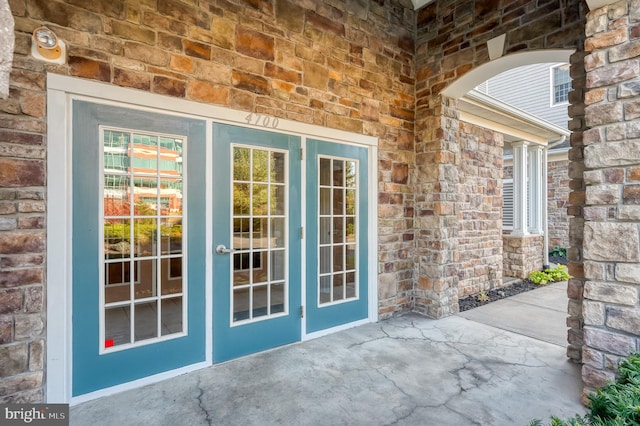 view of exterior entry featuring french doors