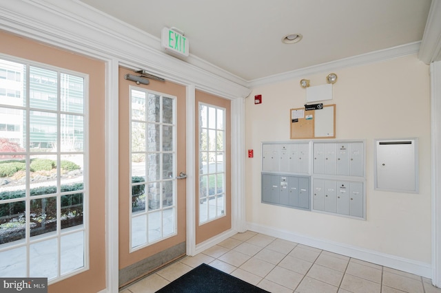 doorway with mail boxes, plenty of natural light, and ornamental molding