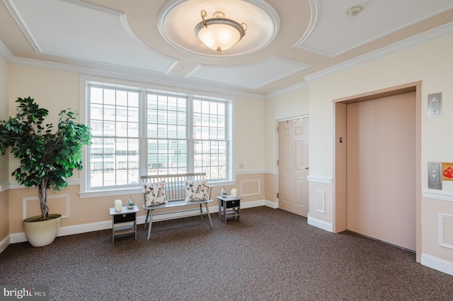 misc room featuring dark colored carpet, elevator, and ornamental molding