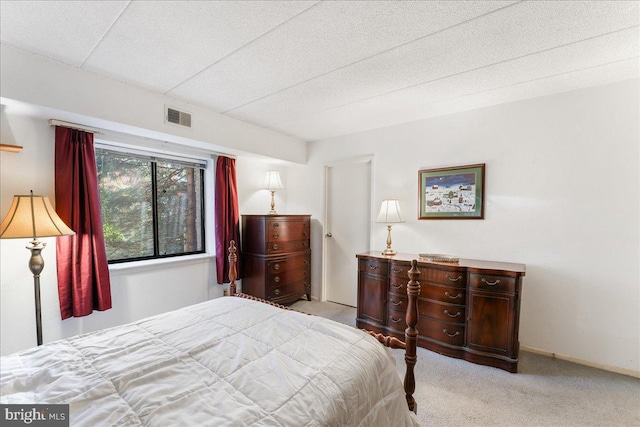 bedroom with light colored carpet