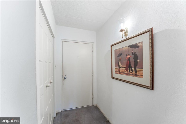 hallway featuring carpet