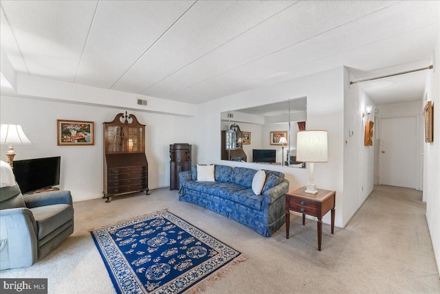 living room with carpet flooring and a textured ceiling