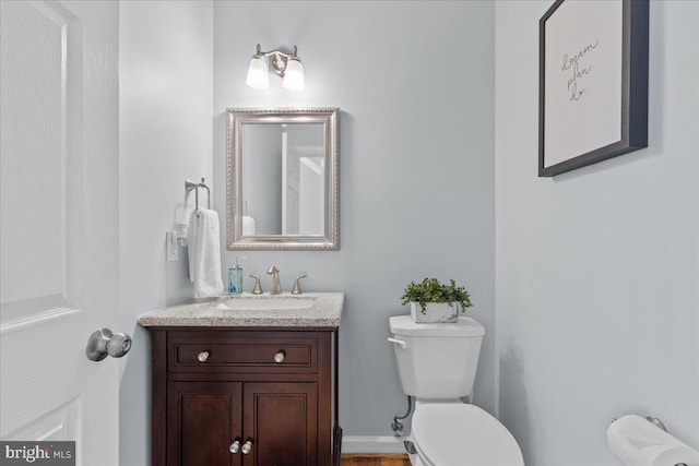 bathroom with toilet and vanity