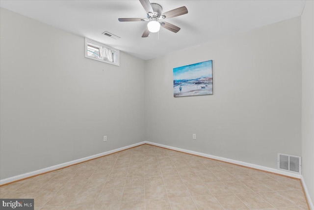 unfurnished room featuring visible vents and baseboards