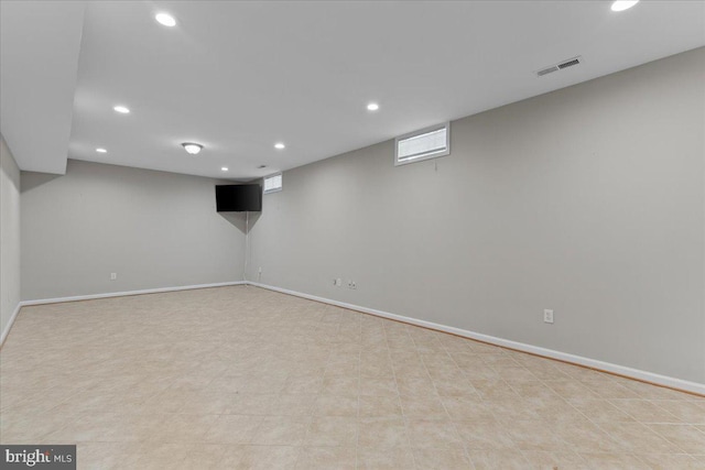 basement with recessed lighting, visible vents, and baseboards